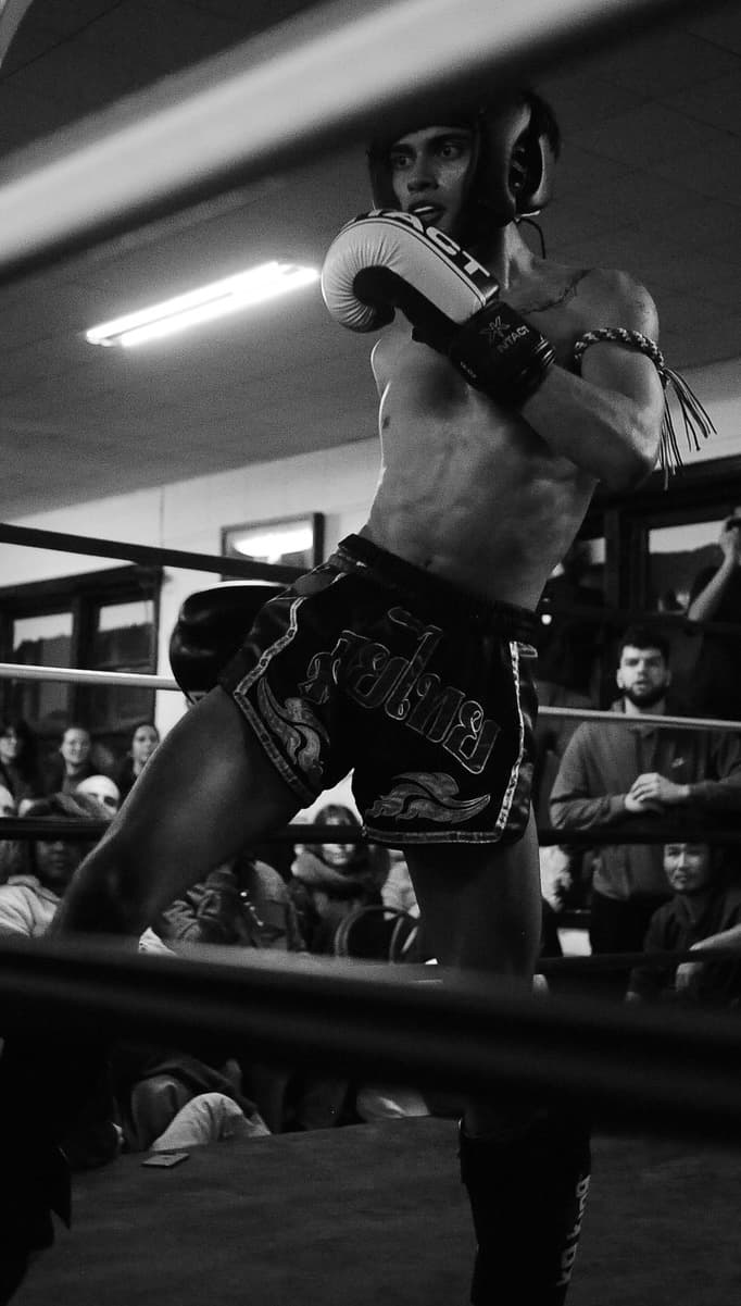 Muay Thai fighter with mongkhon performing Wai Kru before a bout