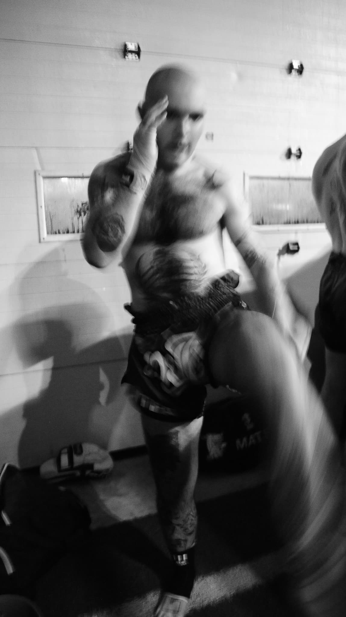 Fighter warming up backstage before a Muay Thai bout